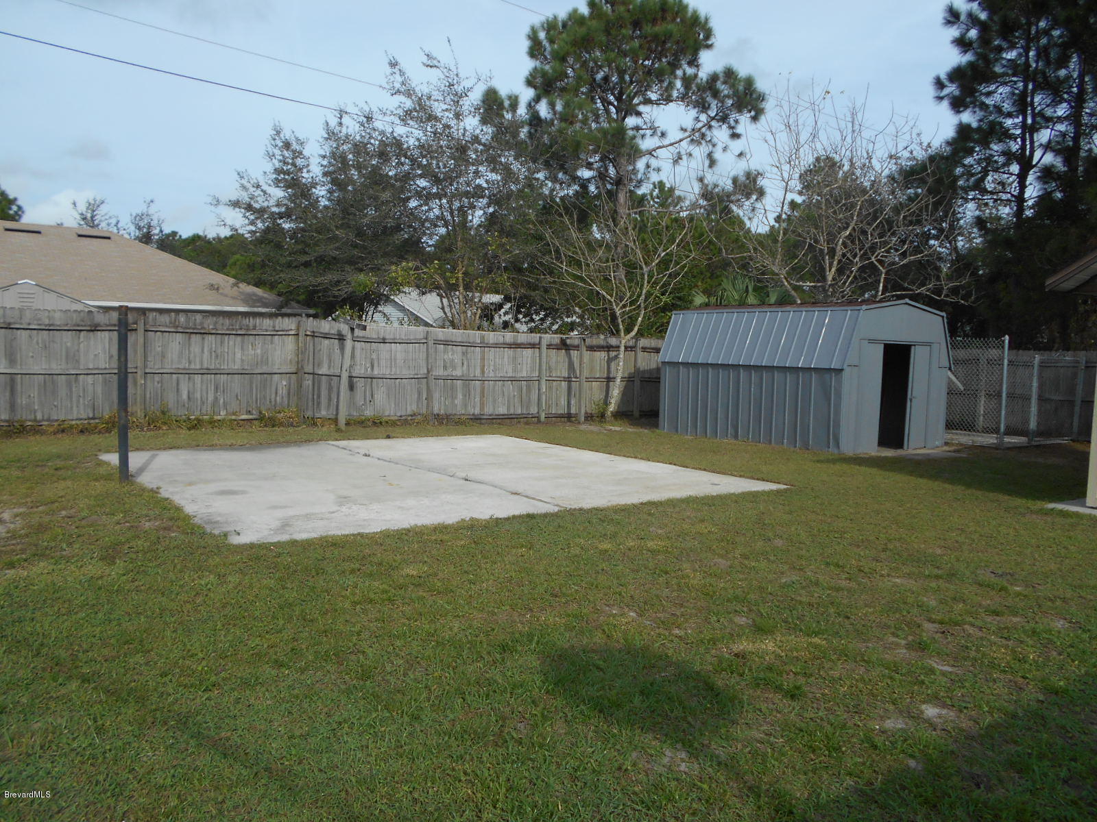 711 Airoso Road Southeast Palm Bay, FL 32909 - Photo 6 of 39 Backyard Patio & Shed