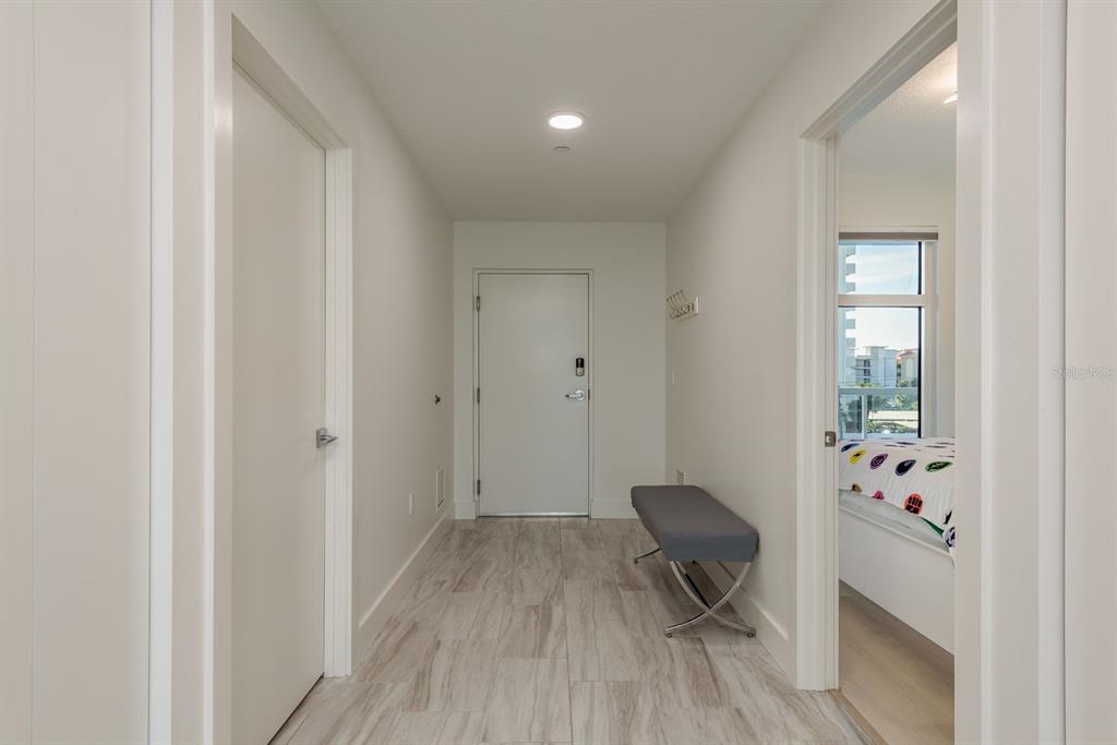 415 Island Way, Unit 402 Clearwater Beach, FL 33767 - Photo 15 of 35 a view of a workspace with furniture and wooden floor