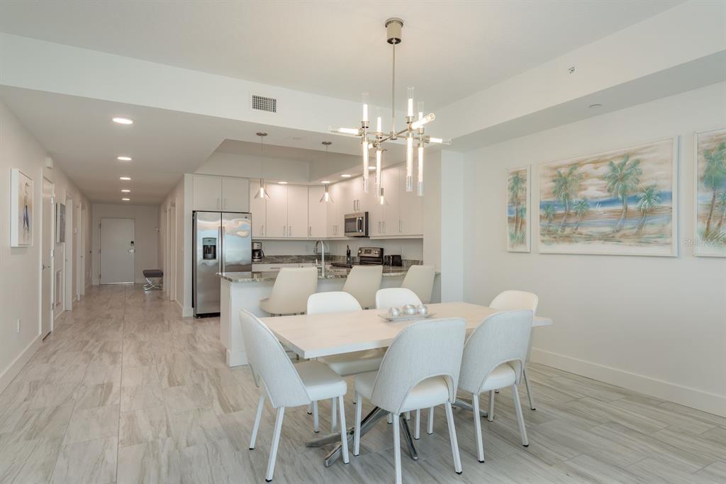 415 Island Way, Unit 402 Clearwater Beach, FL 33767 - Photo 17 of 35 a view of a dining room with furniture