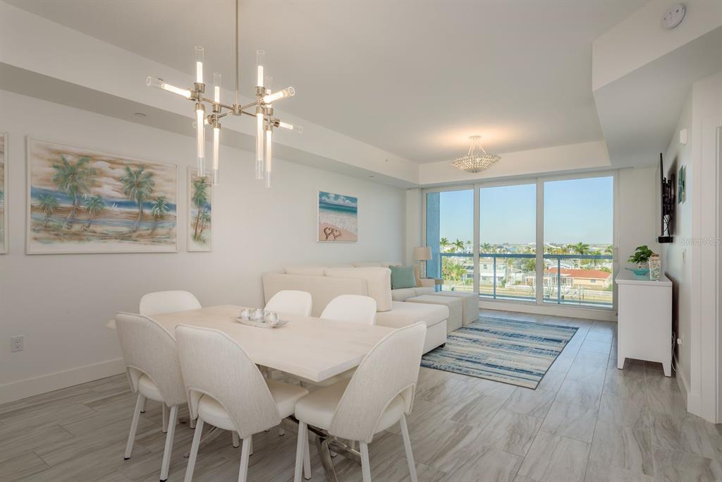 415 Island Way, Unit 402 Clearwater Beach, FL 33767 - Photo 18 of 35 a view of a dining room with furniture window and outside view