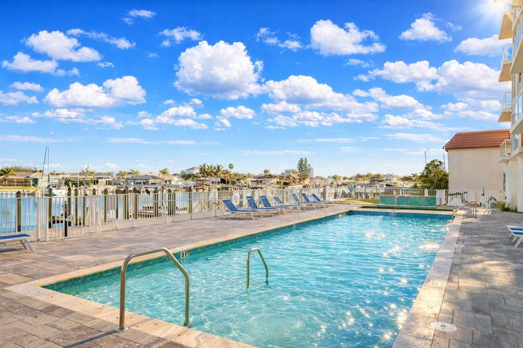 415 Island Way, Unit 402 Clearwater Beach, FL 33767 - Photo 30 of 35 a view of a lake with a yard