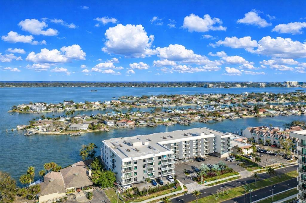 415 Island Way, Unit 402 Clearwater Beach, FL 33767 - Photo 35 of 35 a view of a city with lots of residential buildings and ocean view