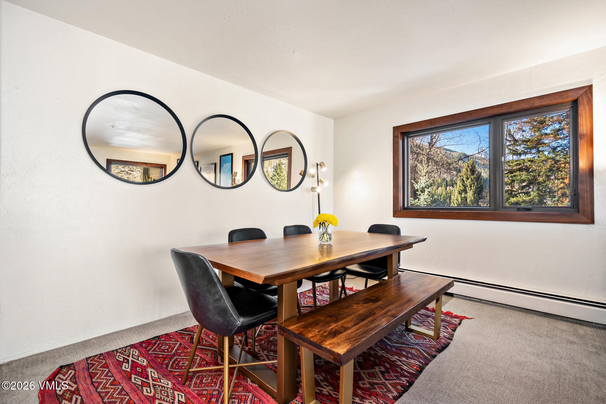 963 Lions Ridge Loop, Unit 502 Vail, CO 81657 - Photo 6 of 30 a table and chairs in a room