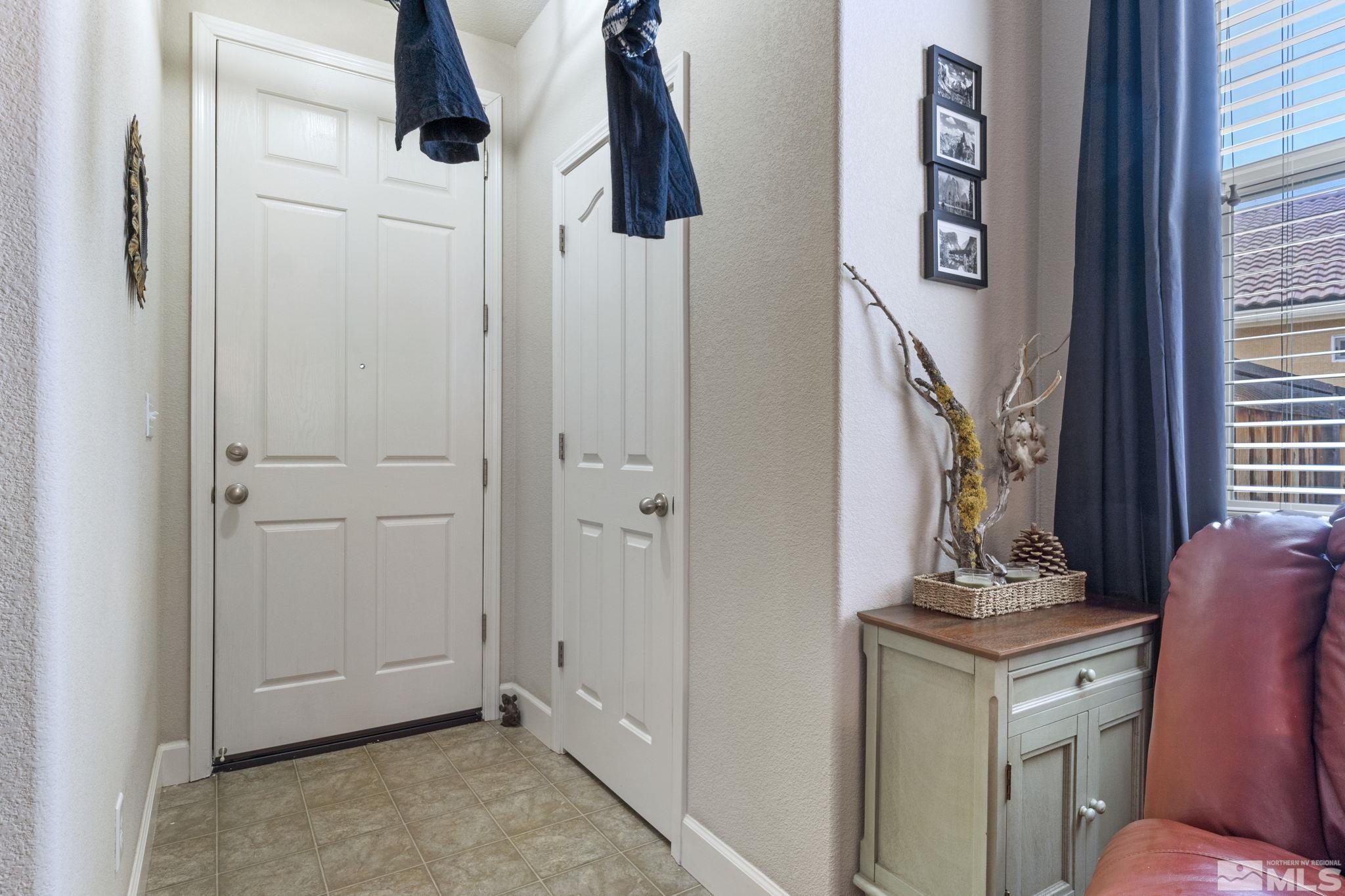 405 Terracina Way Reno, NV 89521 - Photo 5 of 34 a view of an entryway with wooden floor