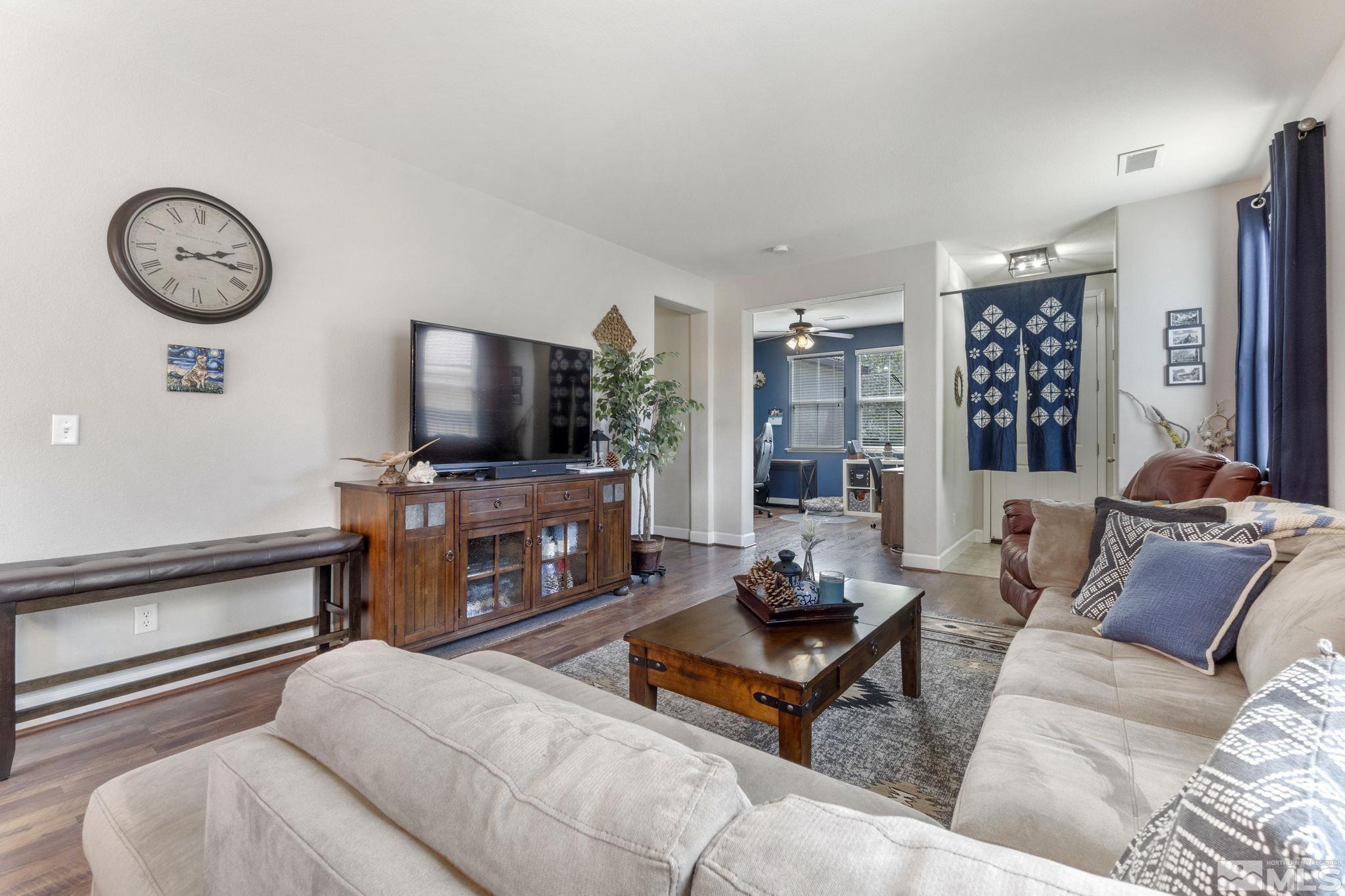 405 Terracina Way Reno, NV 89521 - Photo 9 of 34 a living room with furniture and a flat screen tv