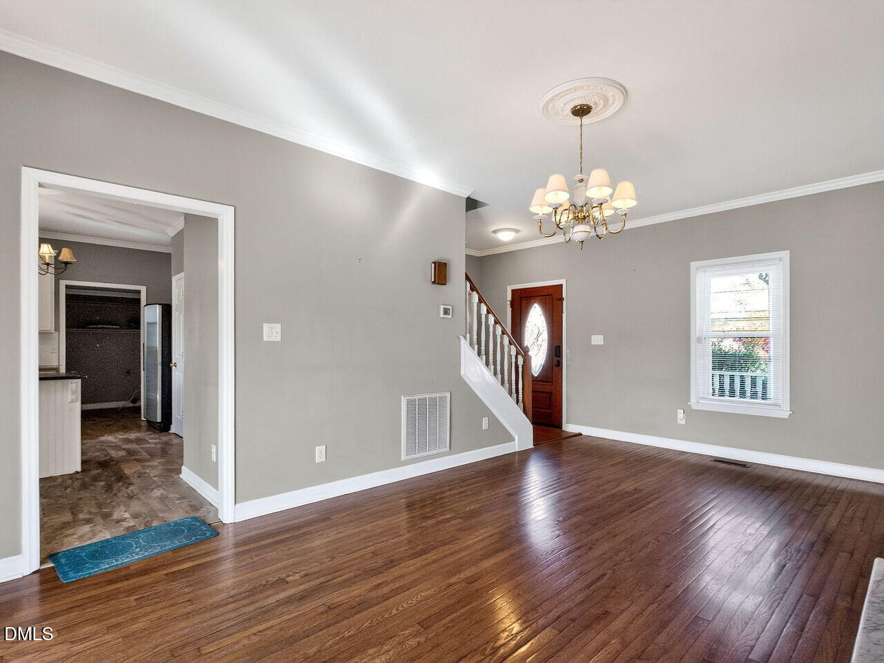 4500 Rivershyre Way Raleigh, NC 27616 - Photo 8 of 42 a view of a room with wooden floor chandelier and windows