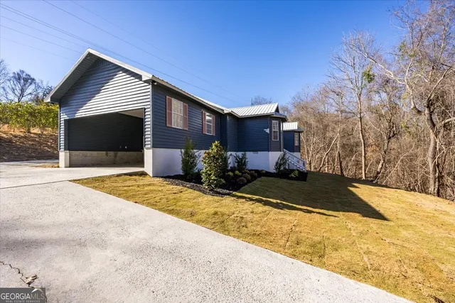 a front view of a house with a yard