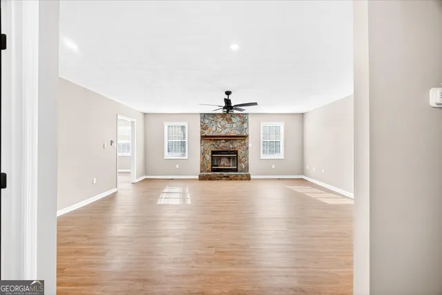 a view of a kitchen with a sink and refrigerator
