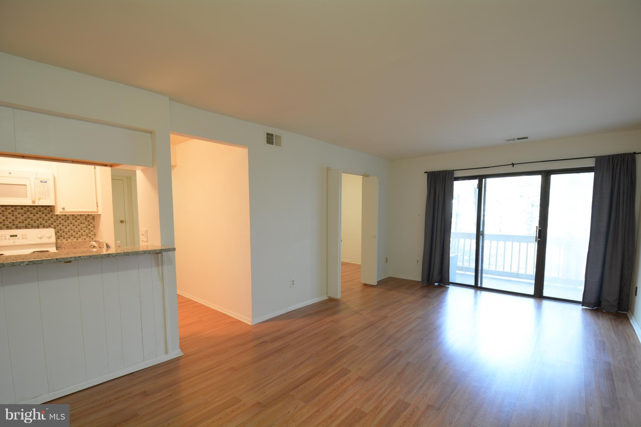 5812 Royal Ridge Drive, Unit O Springfield, VA 22152 - Photo 3 of 19 Family Room with entrance to second bedroom