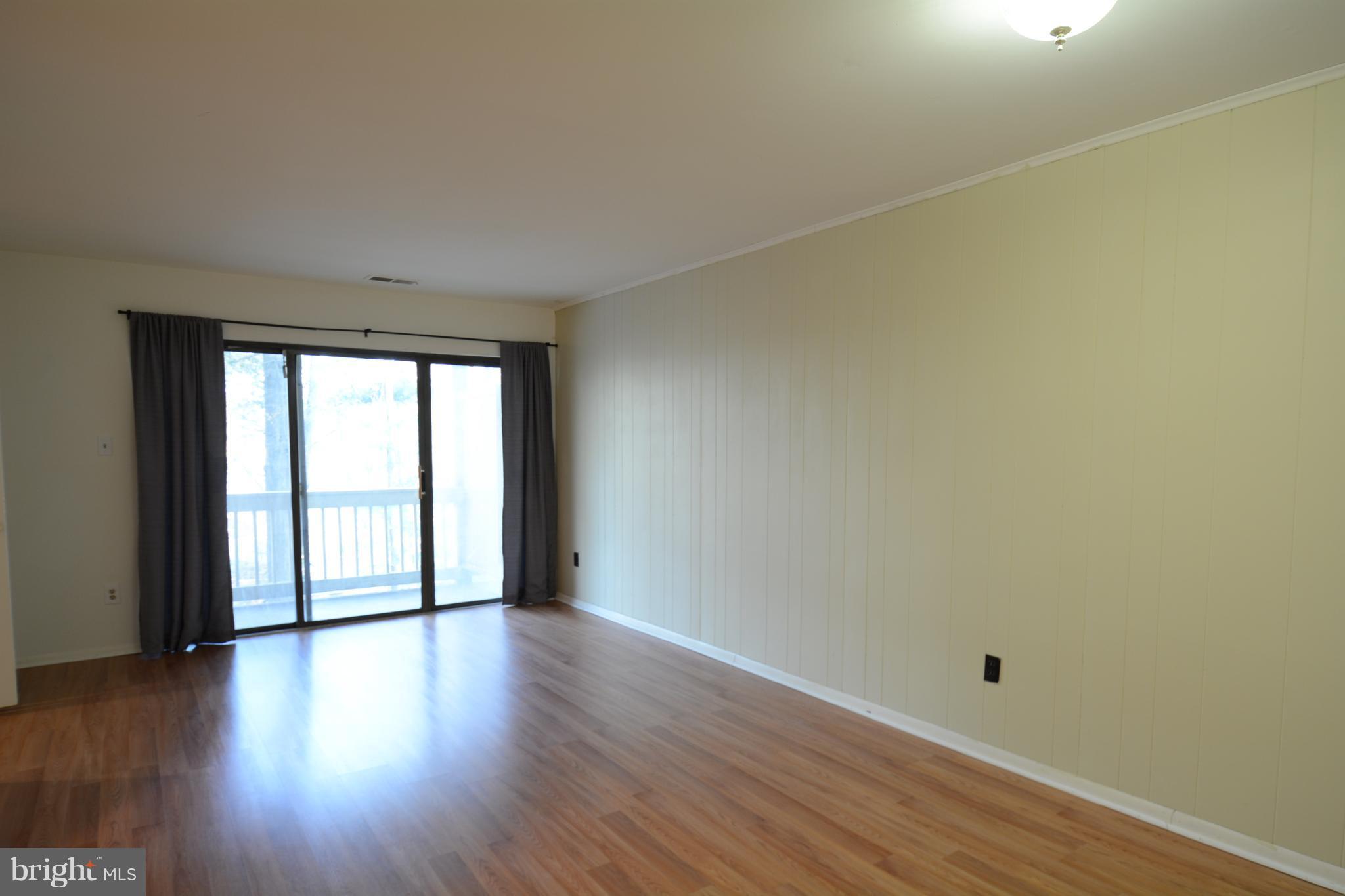 5812 Royal Ridge Drive, Unit O Springfield, VA 22152 - Photo 5 of 19 Large sliding door leads to back balcony