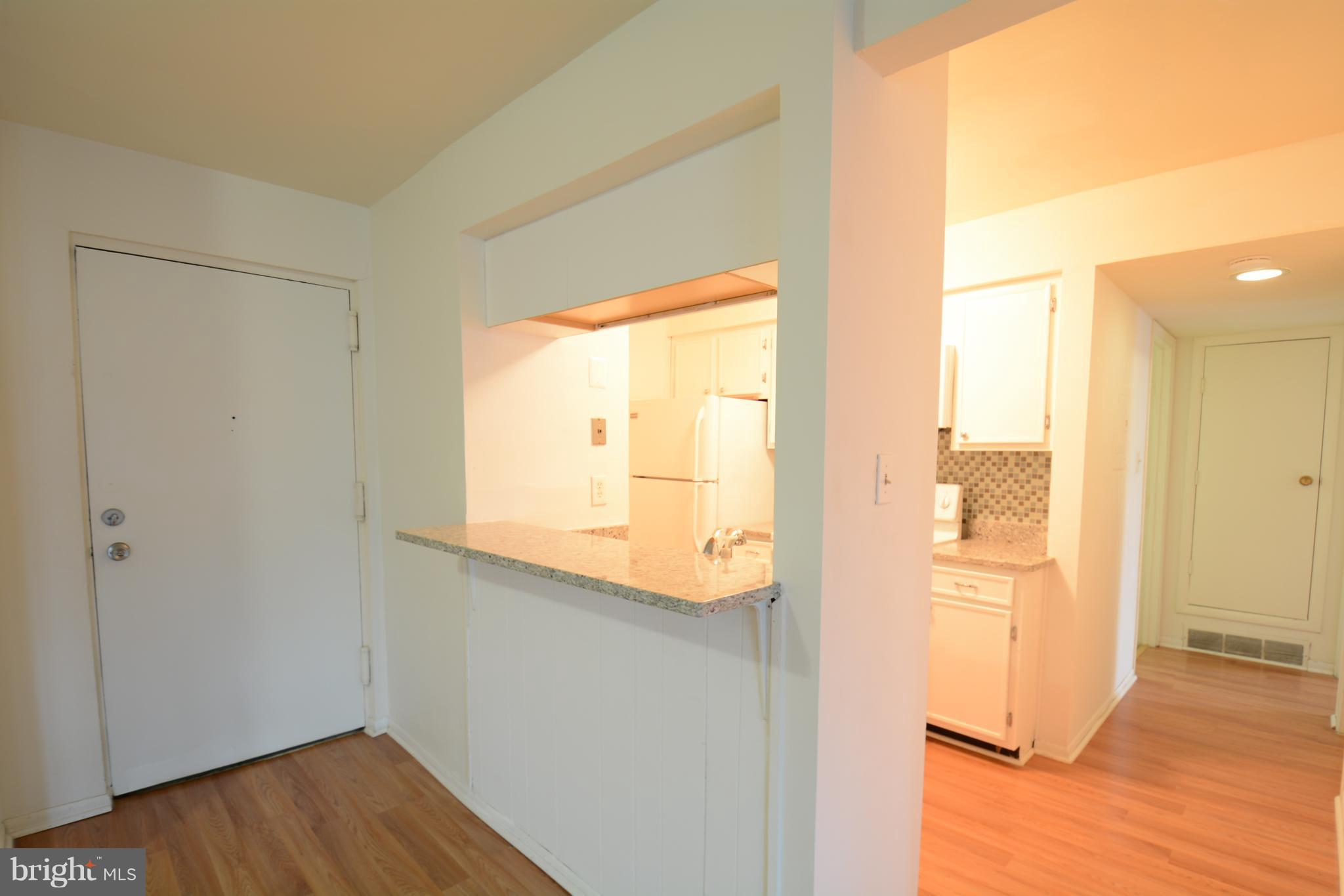5812 Royal Ridge Drive, Unit O Springfield, VA 22152 - Photo 8 of 19 Kitchen bar counter with room for stools