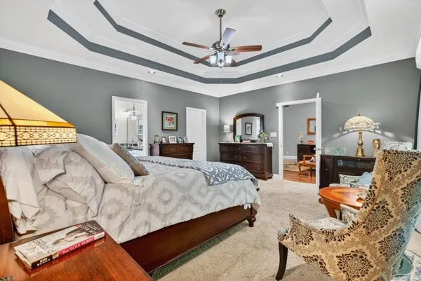 a bedroom with a bed and dresser