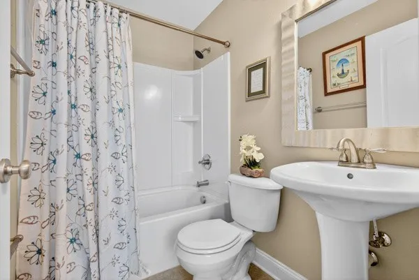 a bathroom with a tub and shower