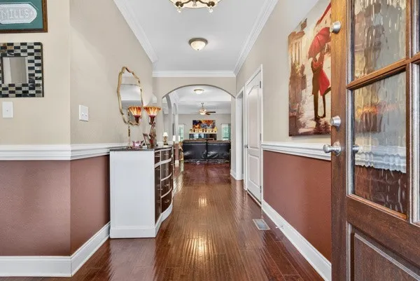 a view of a living room with wooden floor
