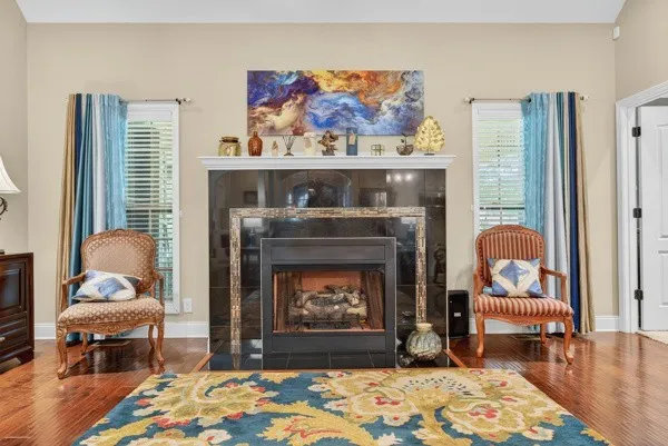 a living room with furniture and a fireplace