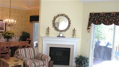 4 Stratford Ridge, Unit 112 Mashpee, MA 02649 - Photo 14 of 28 a living room with furniture and a fireplace