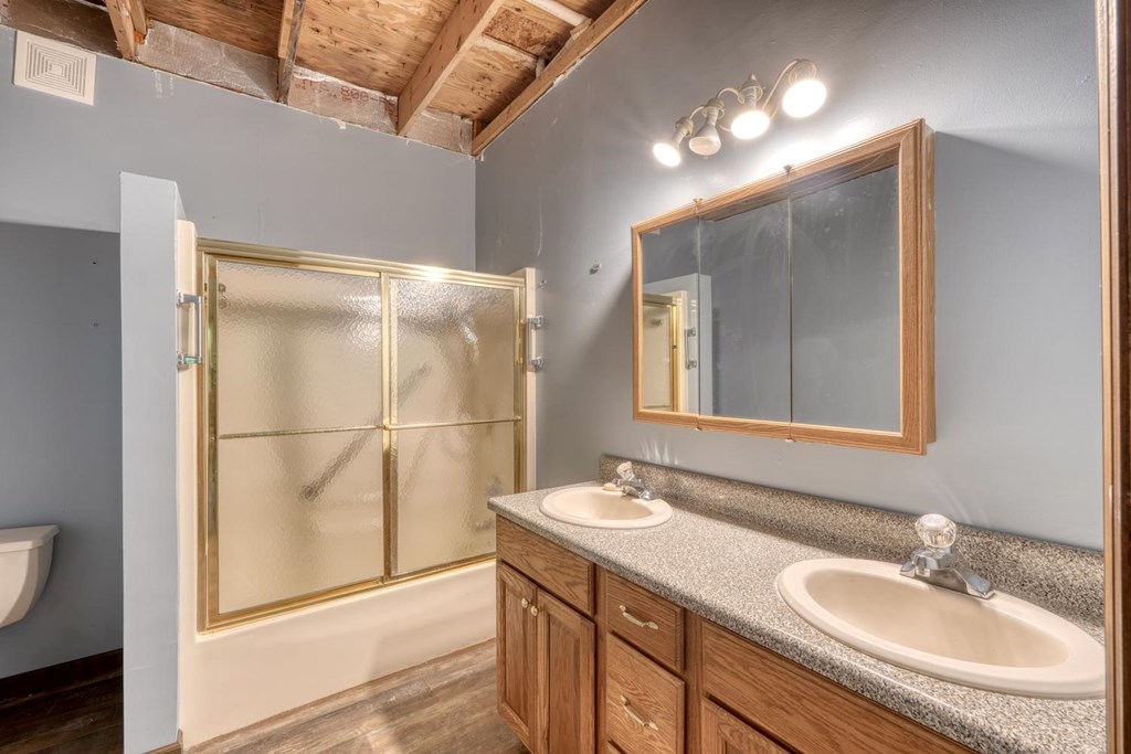 1066 Ridge Road Hiawassee, GA 30546 - Photo 18 of 51 a bathroom with a sink double vanity and a mirror