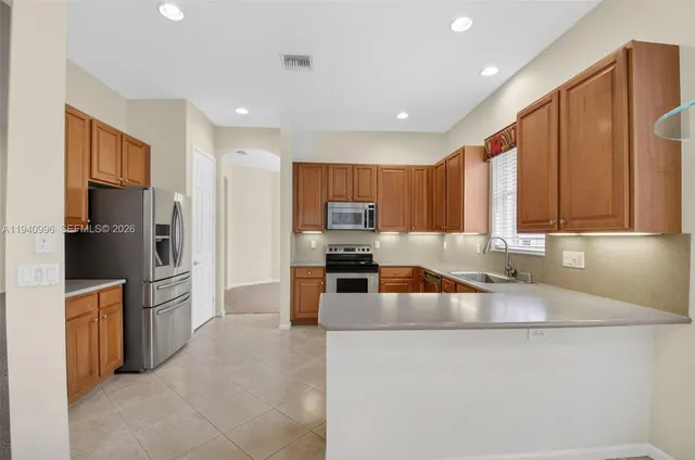 a bedroom with a bed and a flat screen television