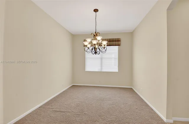 a utility room with sink dryer and washer