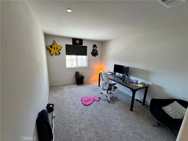 a view of a workspace with furniture