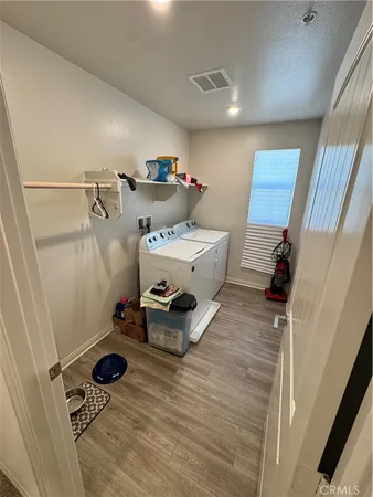 a room with furniture and a wooden floor