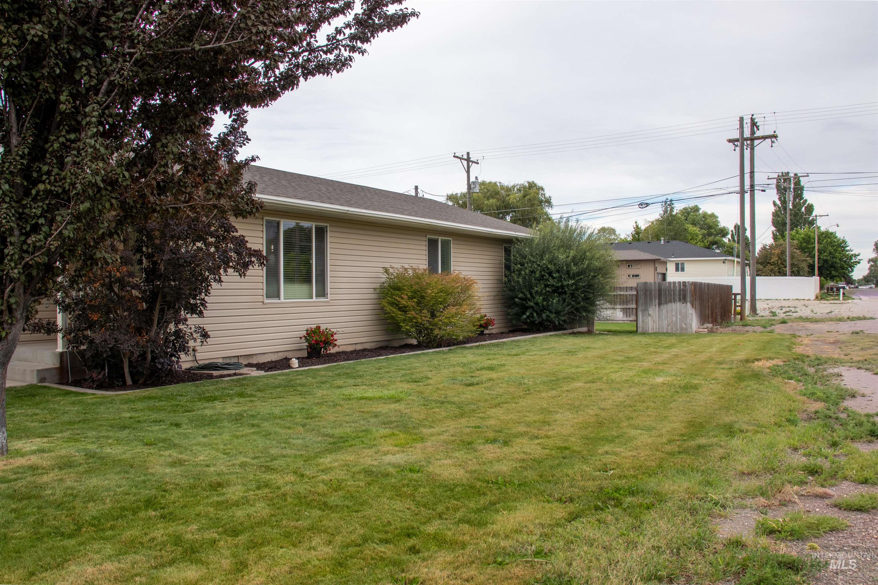 2000 M Street Heyburn, ID 83336 - Photo 12 of 15 Exterior featuring horizontal siding, a gabled roof, and white-framed windows