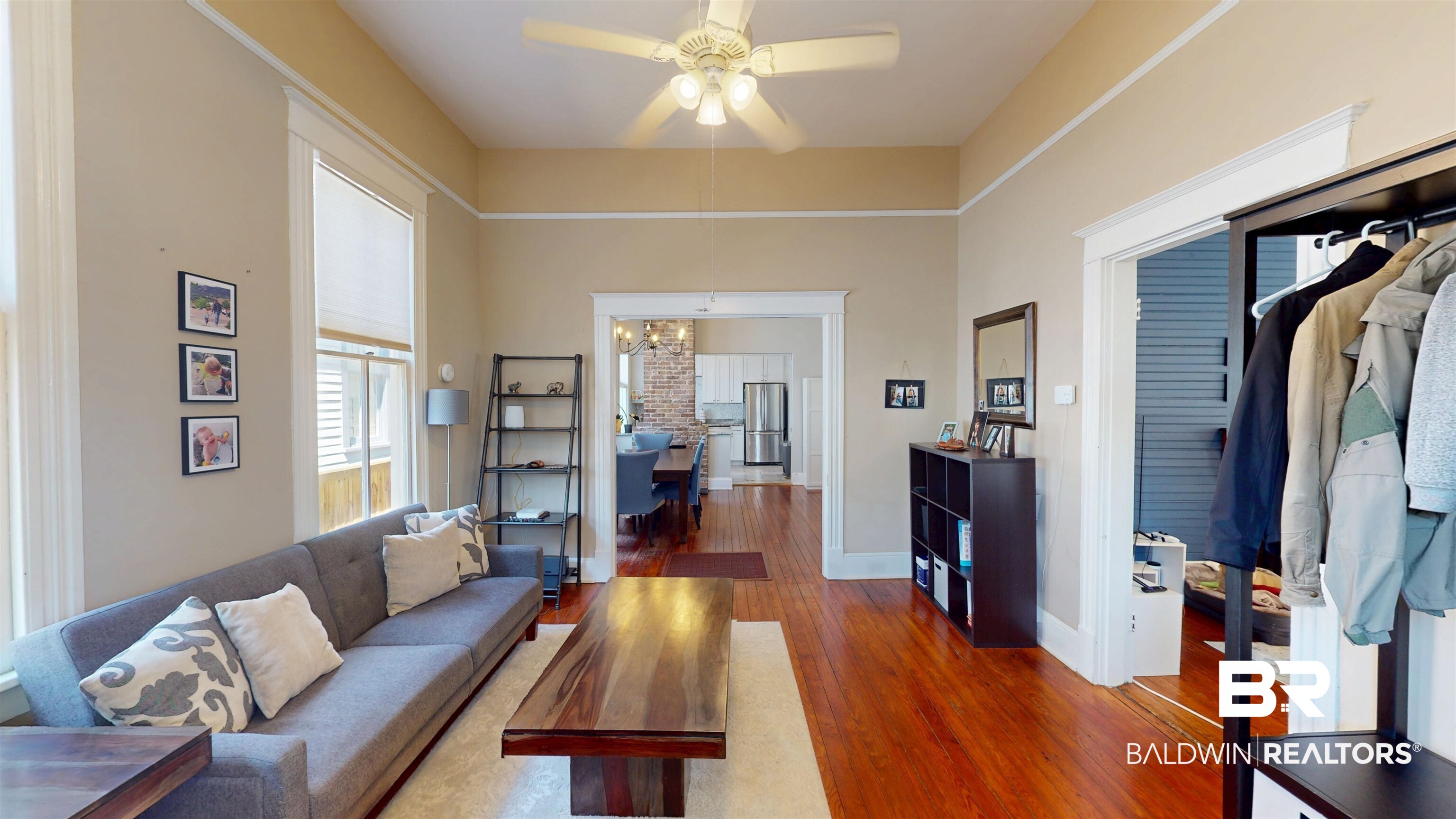 1154 New St Francis Street Mobile, AL 36604 - Photo 8 of 37 Living area with ceiling fan with notable chandelier, baseboards, and wood finished floors