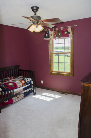 13688 Damen Road Morrison, IL 61270 - Photo 14 of 24 a bedroom with a bed and a window