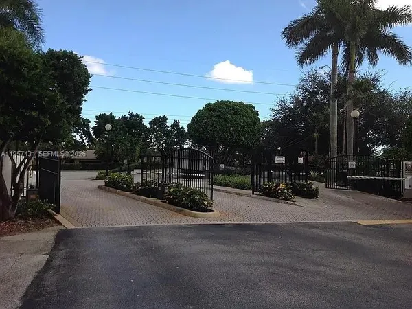 a view of a street with a building in the background