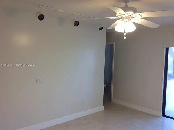a view of a chandelier fan in a room