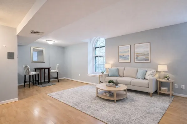 a living room with furniture and a table
