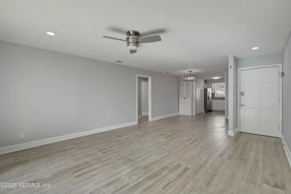 a view of an empty room with a window