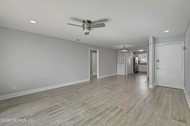 a view of an empty room with a window