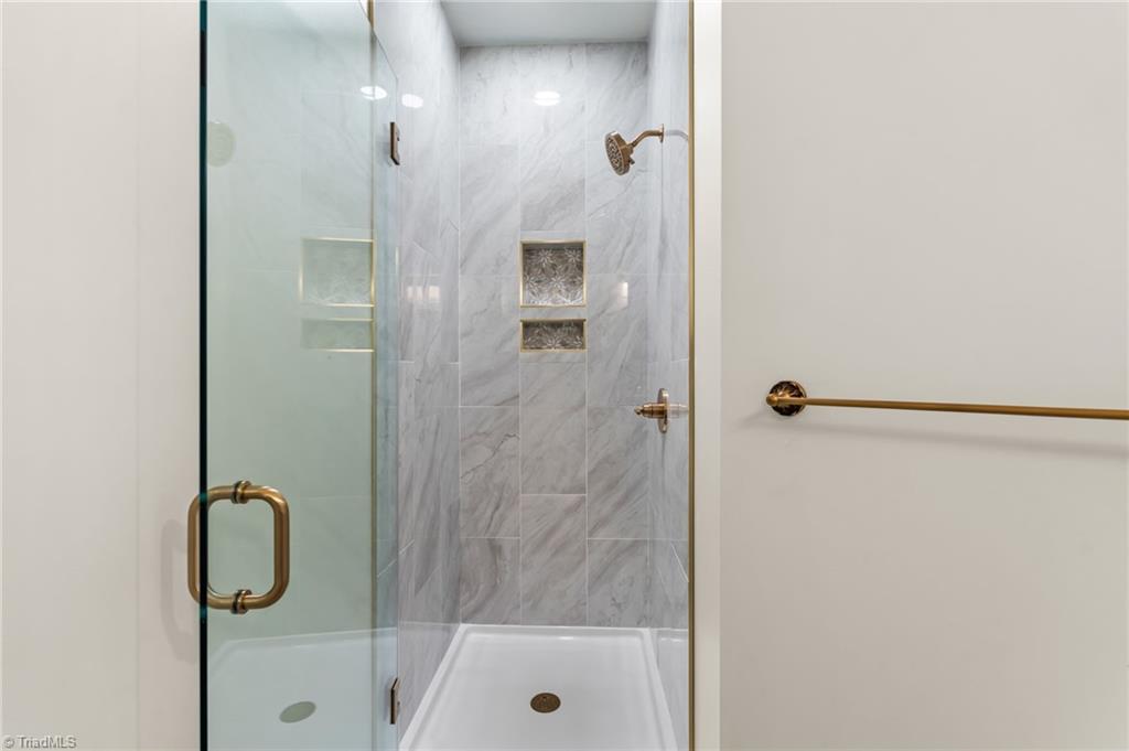 8419 Pheasant Ridge Drive Colfax, NC 27235 - Photo 26 of 49 Main level Full bath with access to the guest bedroom ~ This Tiled shower is stunning!