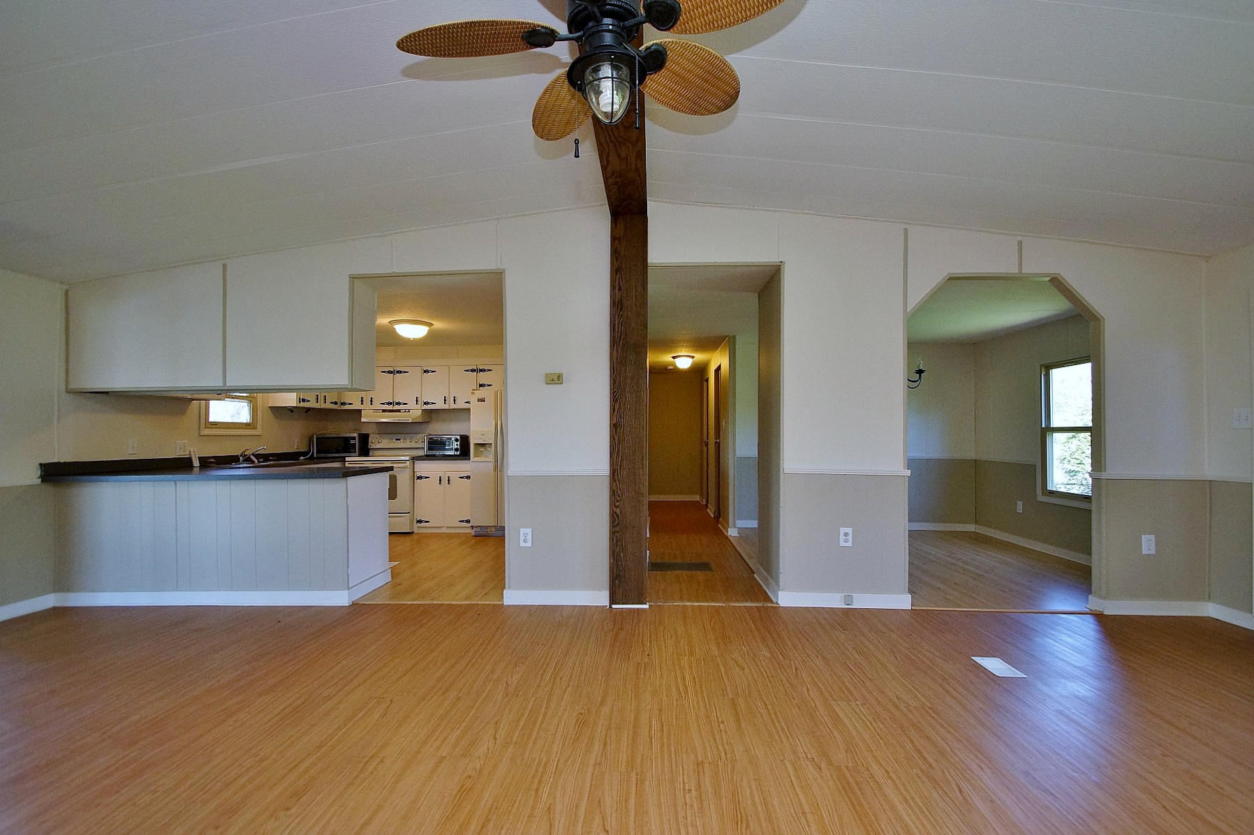 164 Tabernacle Road Penhook, VA 24137 - Photo 12 of 46 a kitchen view with granite countertop wooden floor stainless steel appliances and cabinets