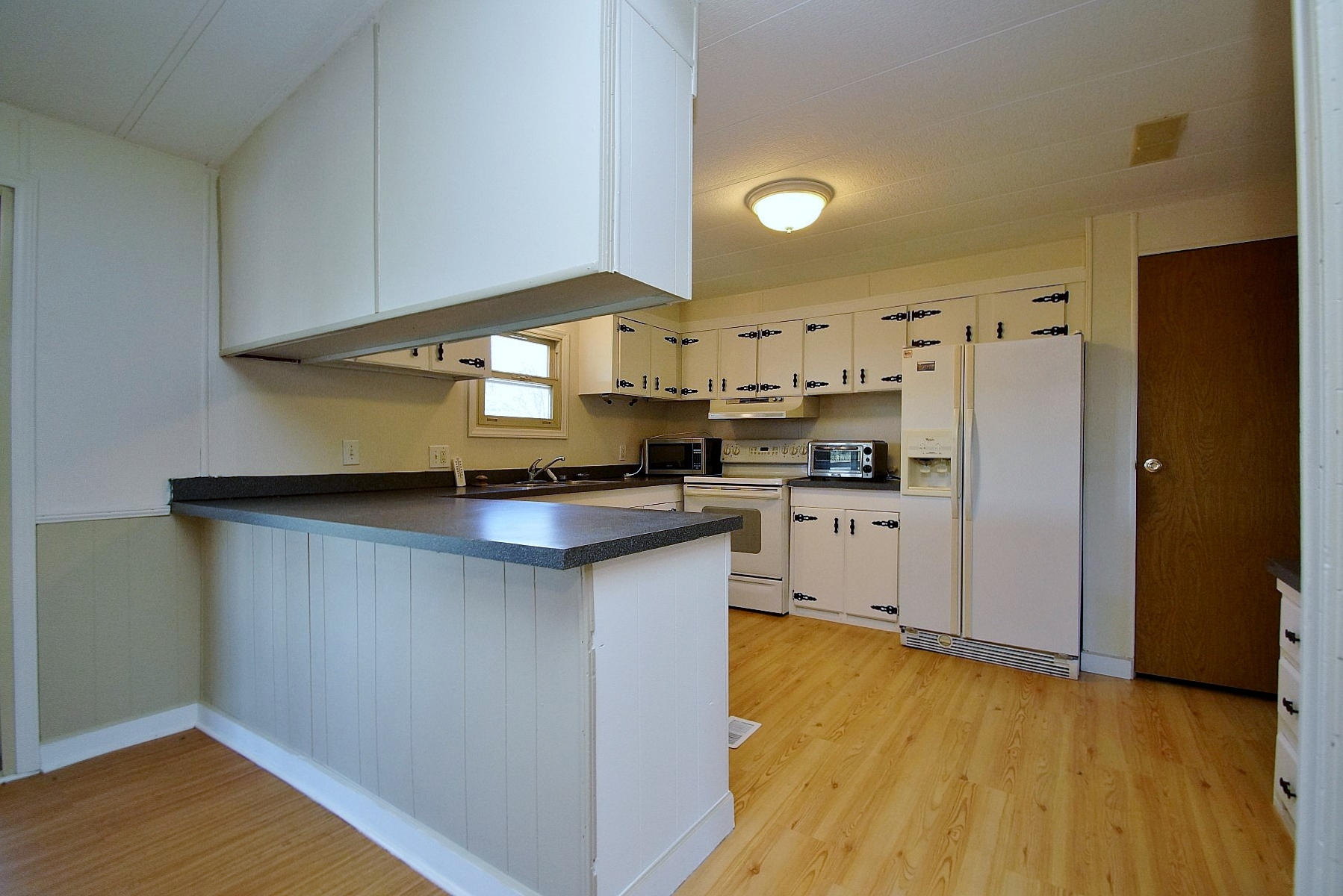 164 Tabernacle Road Penhook, VA 24137 - Photo 13 of 46 a kitchen with stainless steel appliances a refrigerator and a stove top oven