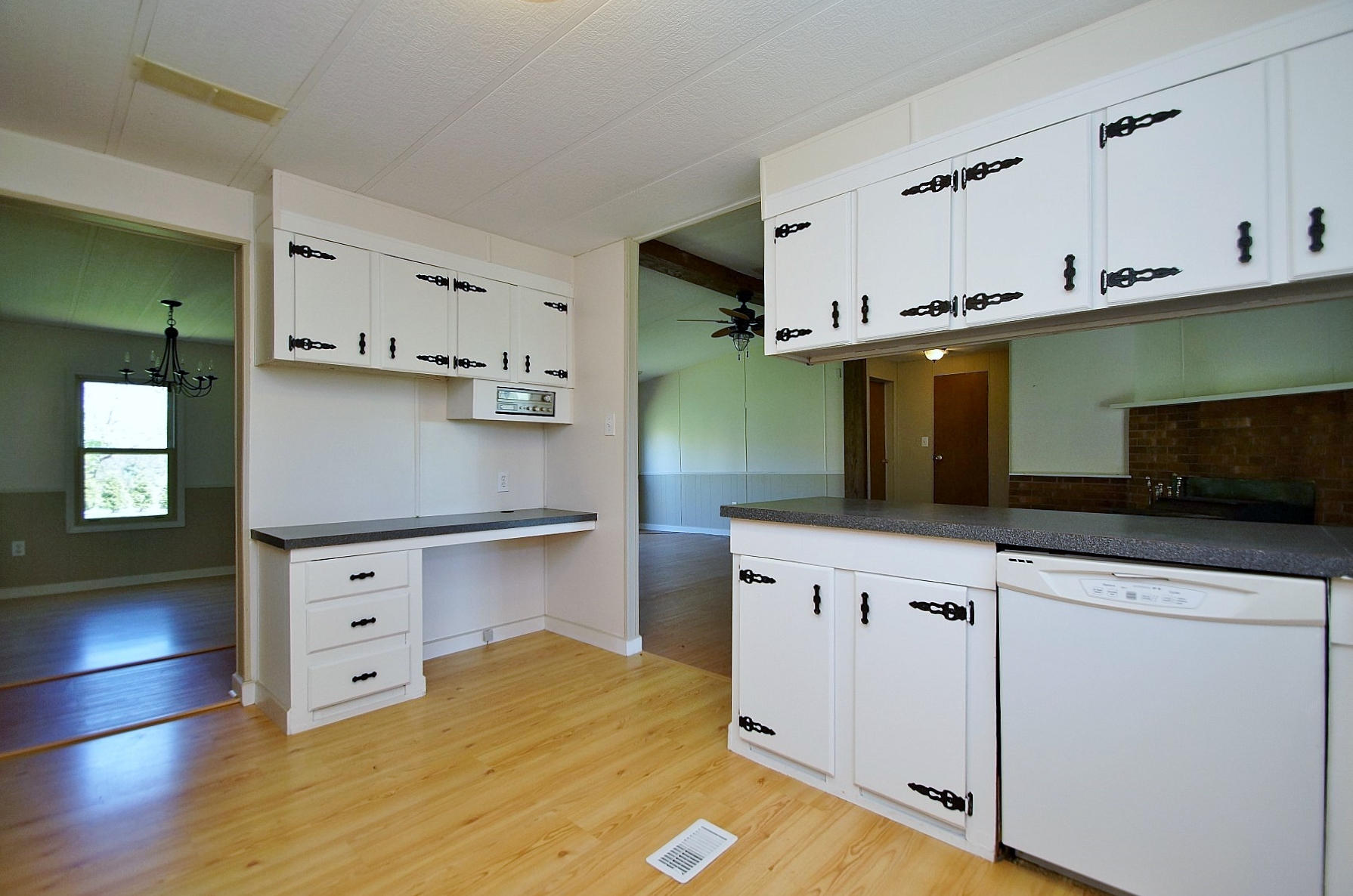 164 Tabernacle Road Penhook, VA 24137 - Photo 14 of 46 a kitchen with stainless steel appliances white cabinets and a refrigerator