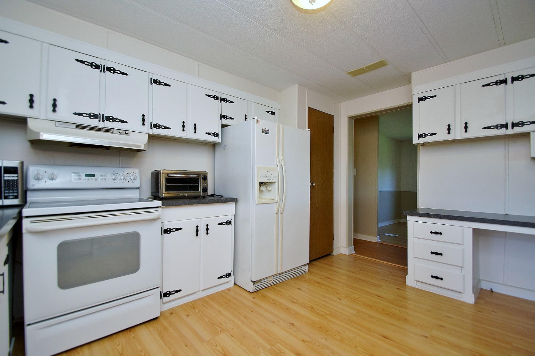 164 Tabernacle Road Penhook, VA 24137 - Photo 15 of 46 a kitchen with stainless steel appliances a stove microwave and refrigerator