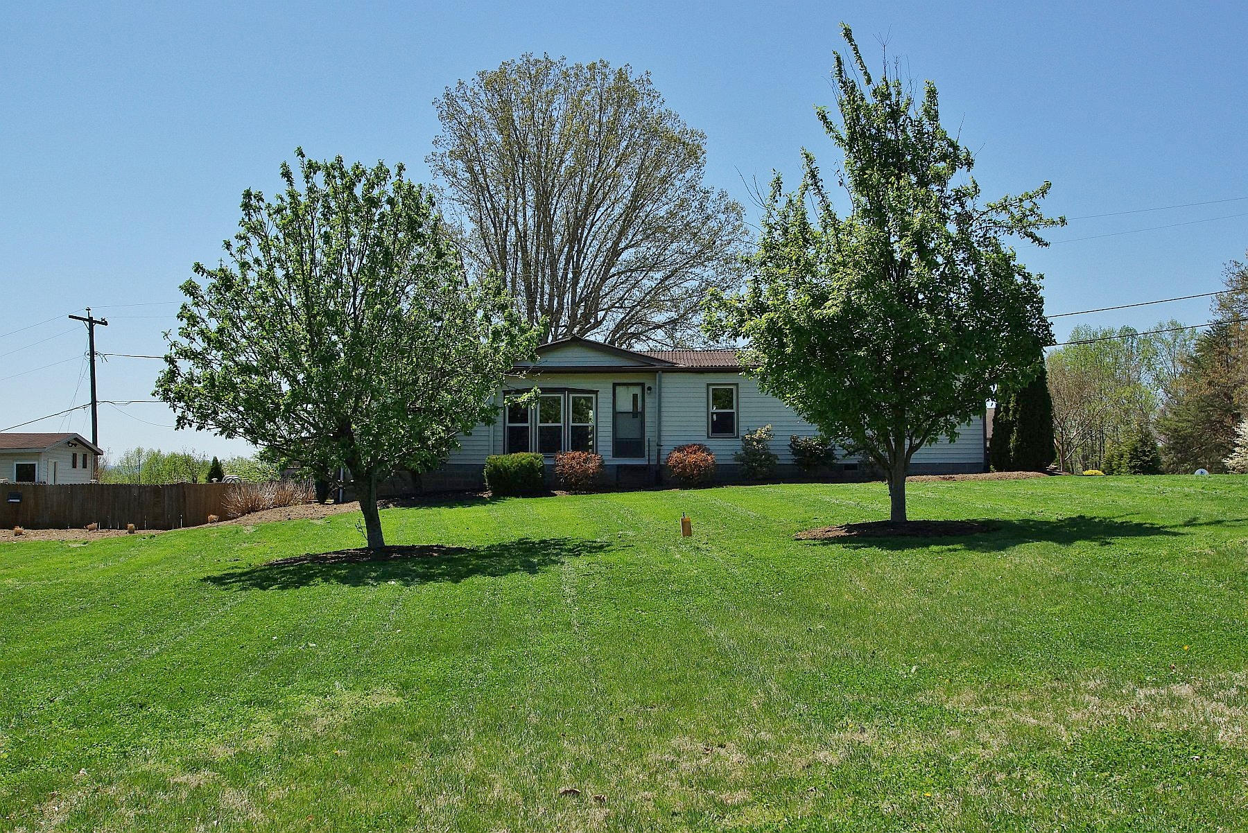 164 Tabernacle Road Penhook, VA 24137 - Photo 39 of 46 a view of a house with a backyard and a tree
