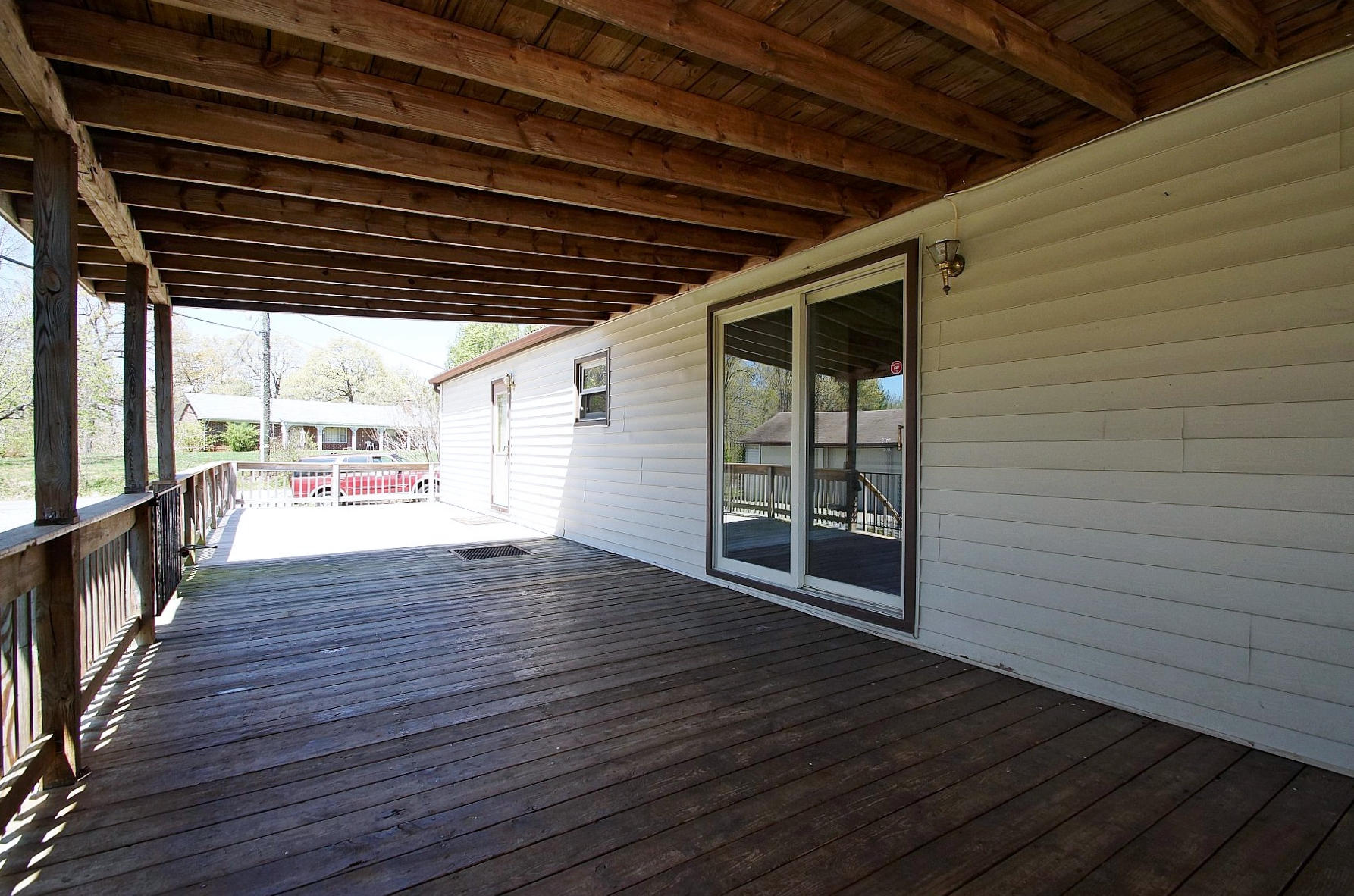 164 Tabernacle Road Penhook, VA 24137 - Photo 6 of 46 a view of an empty room with wooden floor and a window