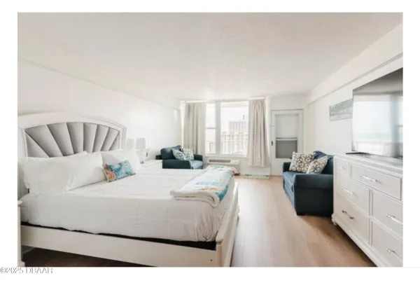 a bedroom with furniture and a couch