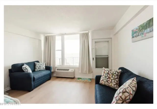 a living room with furniture and a window