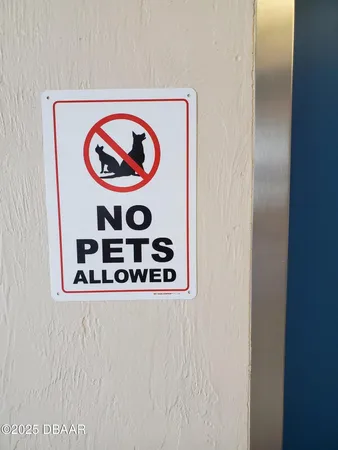 a kitchen with granite countertop cabinets a refrigerator and a sink