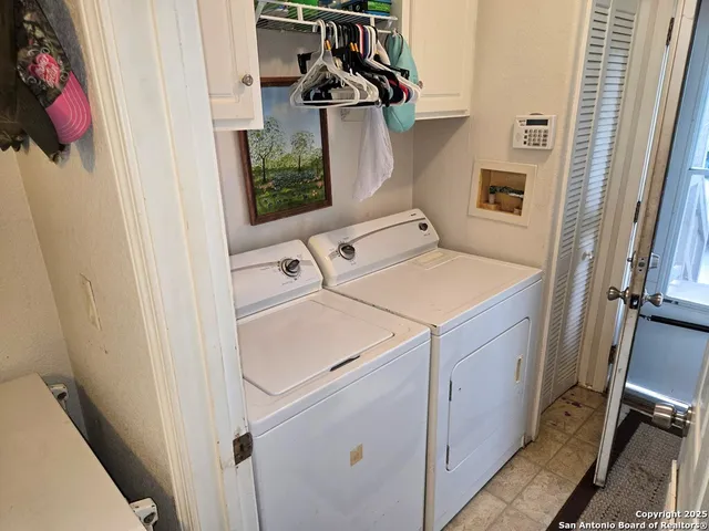 a utility room with dryer and washer