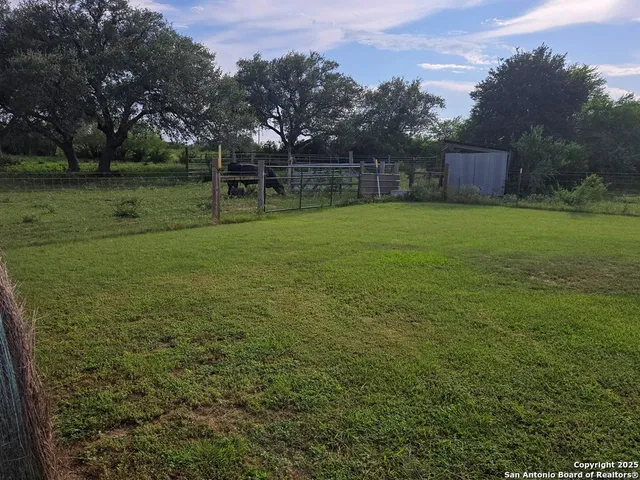 a big yard with lots of green space and mountain view