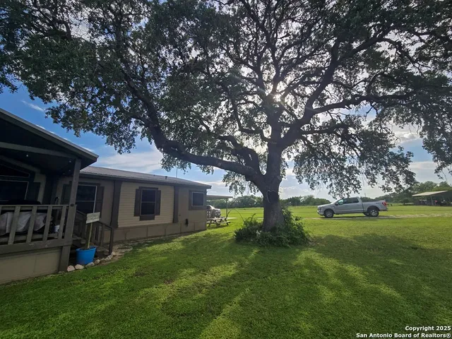 view of a brick house with outdoor space