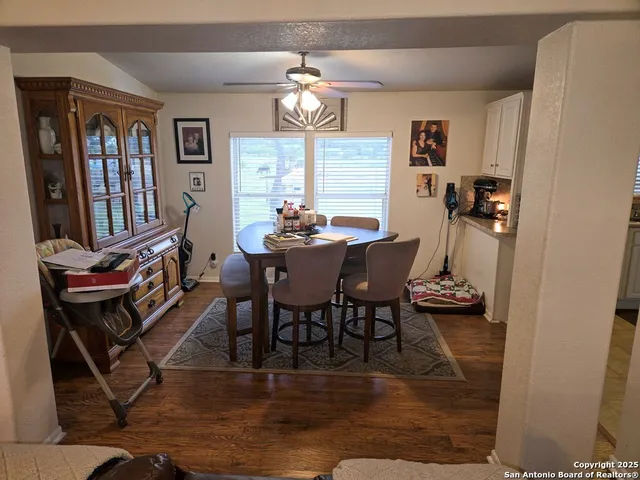 a view of a dining room with furniture window and wooden floor