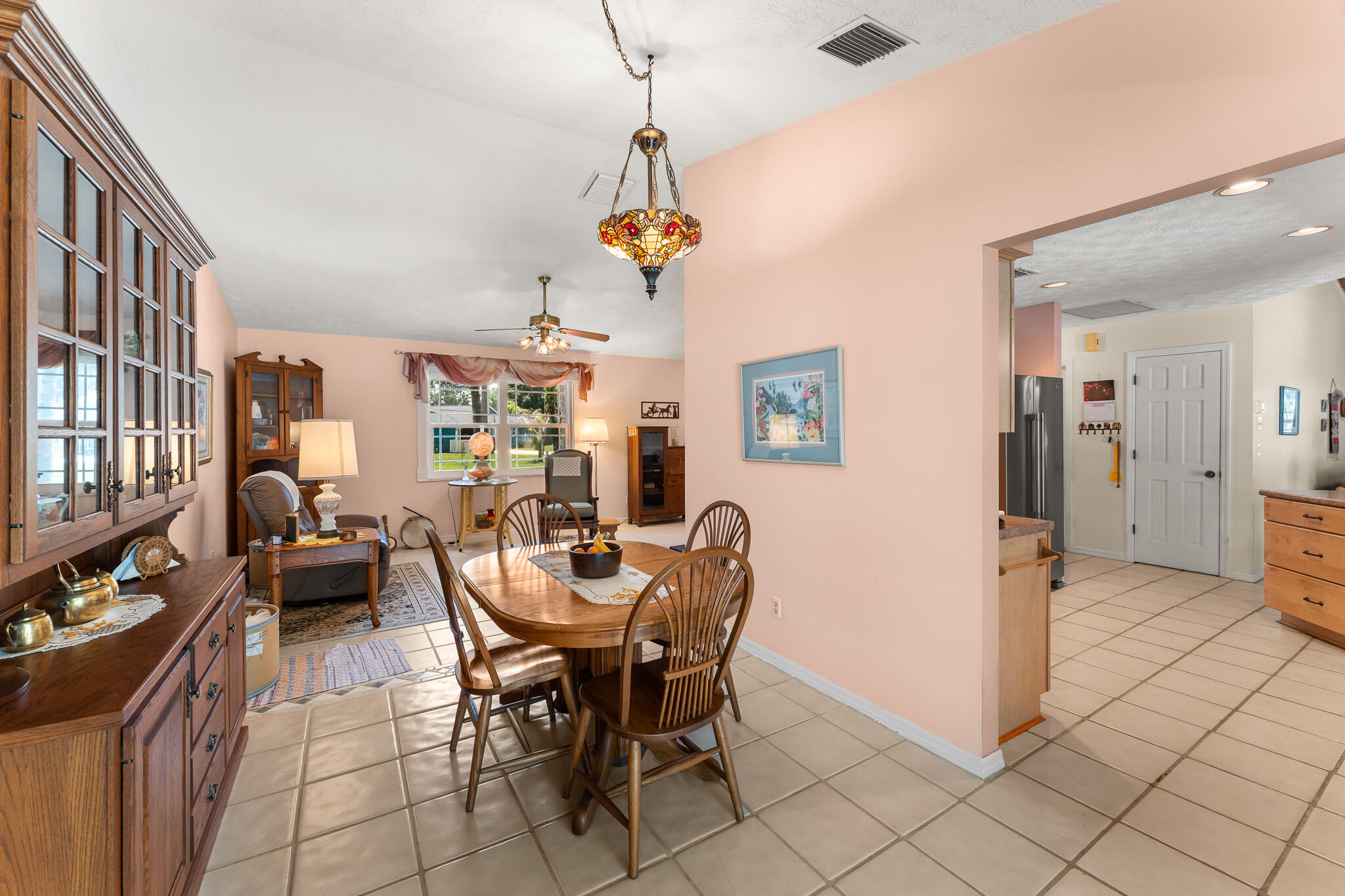 1653 Southwest 85th Terrace Stuart, FL 34997 - Photo 15 of 54 a view of a dining room with furniture