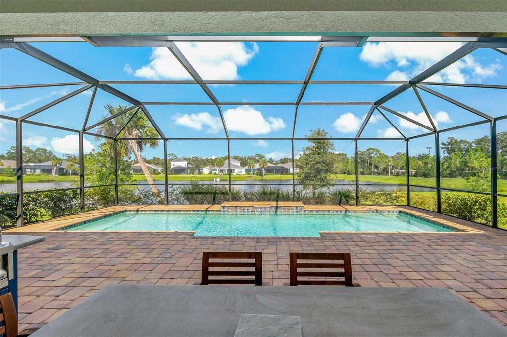 RELAXING BACK SCREENED-IN LANAI WITH PRIVATE POOL & FULLY EQUIPPED OUTDOOR KITCHEN!