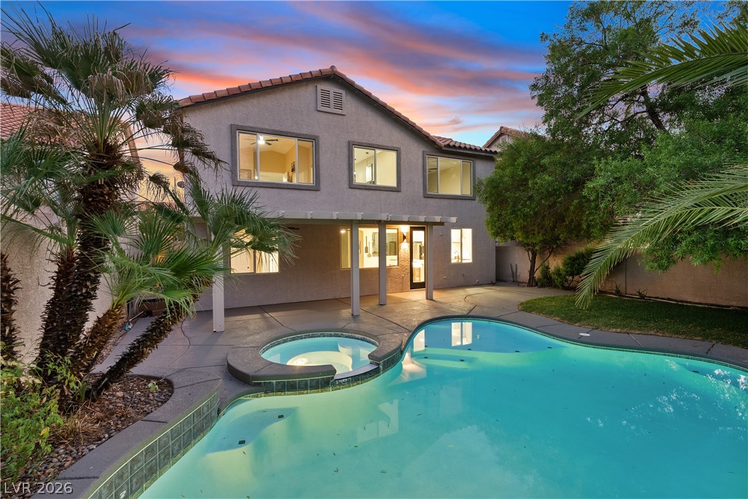 1662 Ravanusa Drive Henderson, NV 89052 - Photo 73 of 74 An inviting backyard oasis offers a sparkling pool and spa for ultimate relaxation.